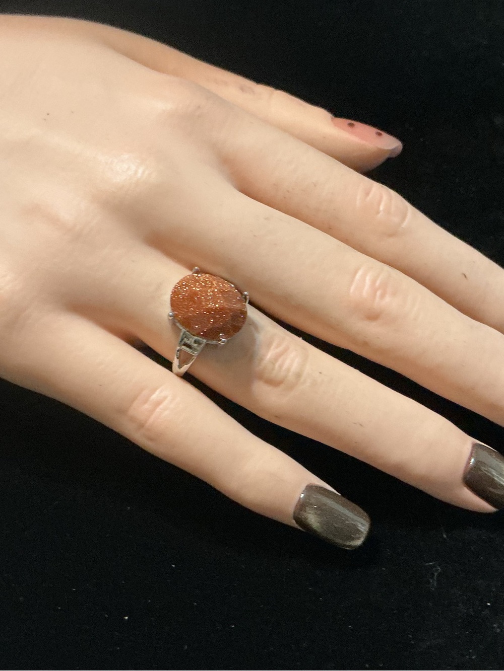Adjust. Faceted sandstone ring